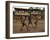 A Group of Panamanian Youths Slide Through the Mud During a Pick-Up Game of Soccer-null-Framed Premium Photographic Print