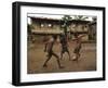 A Group of Panamanian Youths Slide Through the Mud During a Pick-Up Game of Soccer-null-Framed Premium Photographic Print