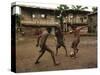 A Group of Panamanian Youths Slide Through the Mud During a Pick-Up Game of Soccer-null-Stretched Canvas