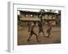 A Group of Panamanian Youths Slide Through the Mud During a Pick-Up Game of Soccer-null-Framed Photographic Print