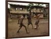 A Group of Panamanian Youths Slide Through the Mud During a Pick-Up Game of Soccer-null-Framed Photographic Print