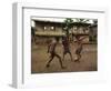 A Group of Panamanian Youths Slide Through the Mud During a Pick-Up Game of Soccer-null-Framed Photographic Print