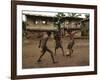 A Group of Panamanian Youths Slide Through the Mud During a Pick-Up Game of Soccer-null-Framed Photographic Print