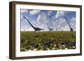 A Group of Sauropod and Hadrosaur Dinosaur Herds Grazing-null-Framed Art Print