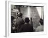 A Group of Scientists Study a Problem by Using Diagrams on a Blackboard-Henry Grant-Framed Photographic Print