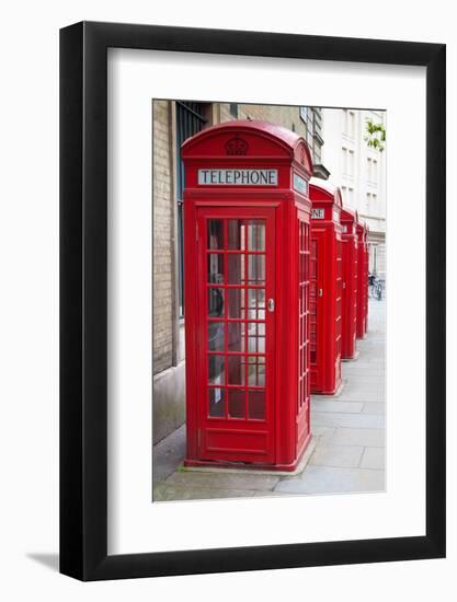 A Group of Typical Red London Phone Cabins-Kamira-Framed Photographic Print