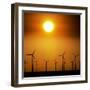 A Group of Wind Turbines are Silhouetted by the Setting Sun-Charlie Riedel-Framed Photographic Print