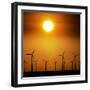 A Group of Wind Turbines are Silhouetted by the Setting Sun-Charlie Riedel-Framed Photographic Print