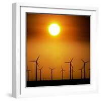 A Group of Wind Turbines are Silhouetted by the Setting Sun-Charlie Riedel-Framed Photographic Print