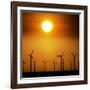 A Group of Wind Turbines are Silhouetted by the Setting Sun-Charlie Riedel-Framed Photographic Print