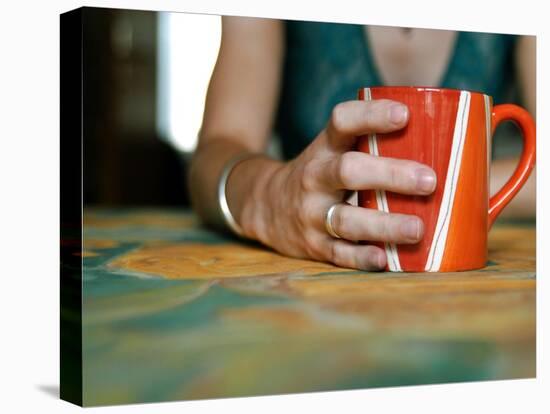 A Hand Holding a Red Mug-Katrin Adam-Stretched Canvas