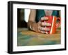 A Hand Holding a Red Mug-Katrin Adam-Framed Photographic Print