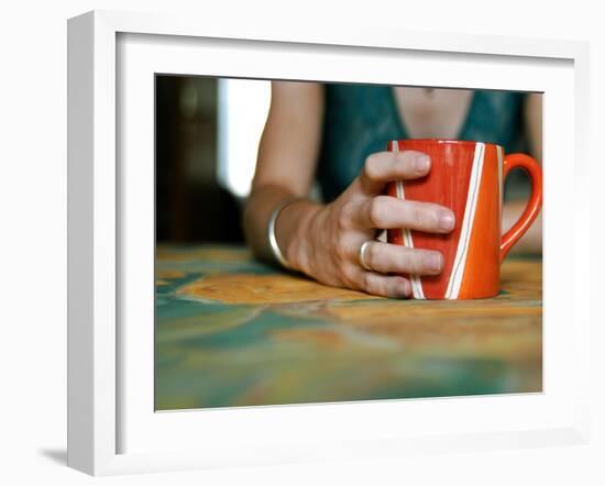 A Hand Holding a Red Mug-Katrin Adam-Framed Photographic Print