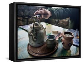 A Hand on a Teapot and Yerba Mate at Refugio Piltriquitron in the Andes of Patagonia, Argentina-Maureen Eversgerd-Framed Stretched Canvas