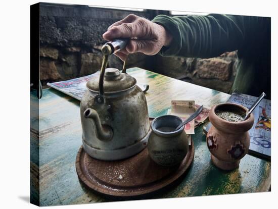 A Hand on a Teapot and Yerba Mate at Refugio Piltriquitron in the Andes of Patagonia, Argentina-Maureen Eversgerd-Stretched Canvas