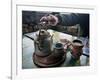 A Hand on a Teapot and Yerba Mate at Refugio Piltriquitron in the Andes of Patagonia, Argentina-Maureen Eversgerd-Framed Photographic Print