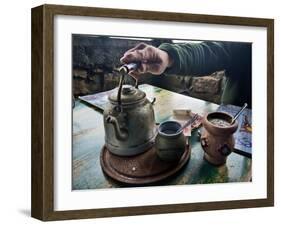 A Hand on a Teapot and Yerba Mate at Refugio Piltriquitron in the Andes of Patagonia, Argentina-Maureen Eversgerd-Framed Photographic Print