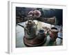 A Hand on a Teapot and Yerba Mate at Refugio Piltriquitron in the Andes of Patagonia, Argentina-Maureen Eversgerd-Framed Photographic Print