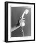 A Hand with Manicured Finger Nails Hold Up a White Telephone Handset-null-Framed Photographic Print