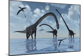 A Herd of Omeisaurus Sauropod Dinosaurs in Shallow Water-null-Mounted Art Print