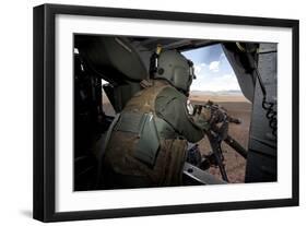 A Hh-60G Pave Hawk Gunner Fires His Gau-17 Machine Gun-null-Framed Photographic Print