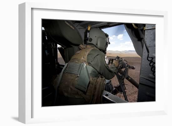 A Hh-60G Pave Hawk Gunner Fires His Gau-17 Machine Gun-null-Framed Photographic Print