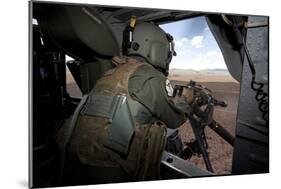 A Hh-60G Pave Hawk Gunner Fires His Gau-17 Machine Gun-null-Mounted Photographic Print