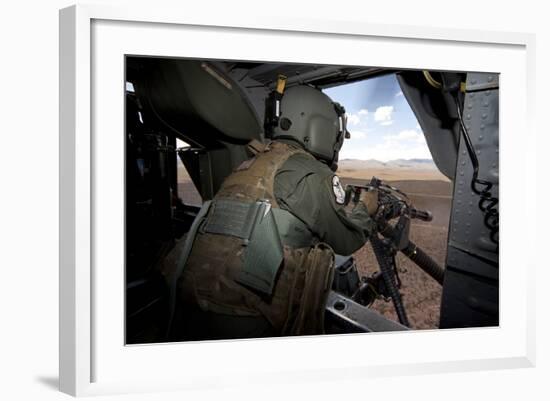 A Hh-60G Pave Hawk Gunner Fires His Gau-17 Machine Gun-null-Framed Photographic Print