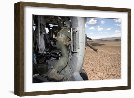 A Hh-60G Pave Hawk Gunner Fires His Gau-17 Machine Gun-null-Framed Photographic Print