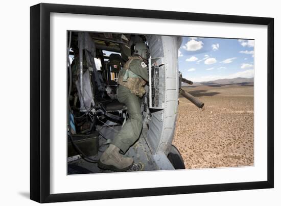 A Hh-60G Pave Hawk Gunner Fires His Gau-17 Machine Gun-null-Framed Photographic Print