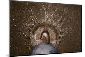 A Hiking Boot Splashing in a Puddle in a Parking Lot in Boulder, Colorado-Sergio Ballivian-Mounted Photographic Print