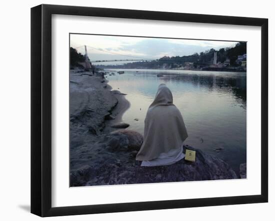 A Hindu Pilgrim Meditates Along the Bank of the Ganges River-null-Framed Premium Photographic Print