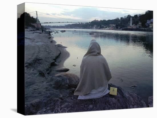 A Hindu Pilgrim Meditates Along the Bank of the Ganges River-null-Stretched Canvas