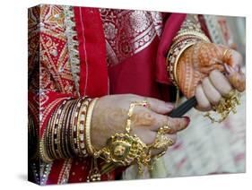 A Hindu Woman Performs Religious Rituals as She Offers Prayers to the Sun God-null-Stretched Canvas