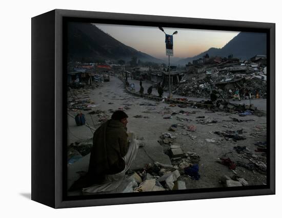 A Homeless Pakistani Earthquake Survivor Sits on the Roadside-null-Framed Stretched Canvas