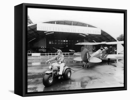 A Honda All Terrain Cycle Pulling a Vintage Biplane, 1982-null-Framed Stretched Canvas