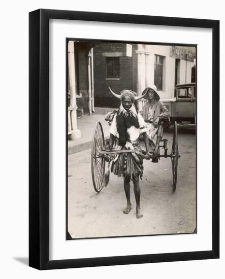 A Horned Rickshaw Man in Bulawayo, Southern Rhodesia (Now Zimbabwe)-null-Framed Photographic Print