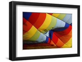 A Hot Air Balloon Pilot's Silhouette Is Seen as He Prepares His Balloon for Take Off-Baz Ratner-Framed Photographic Print