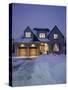 A House in a Snow Covered Landscape Lit Up at Night-null-Stretched Canvas