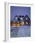 A House in a Snow Covered Landscape Lit Up at Night-null-Framed Photographic Print