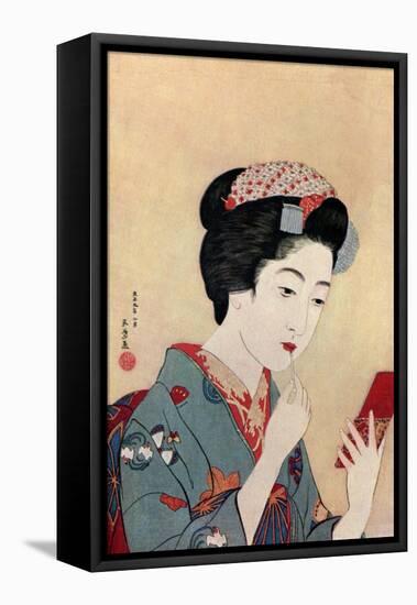 A Japanese woman using a beni brush to paint her lips, 1920 (1930).Artist: Hashiguchi Goyo-Hashiguchi Goyo-Framed Stretched Canvas