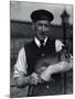 A Keeper Holds a Wallaby, October 1920-Frederick William Bond-Mounted Photographic Print