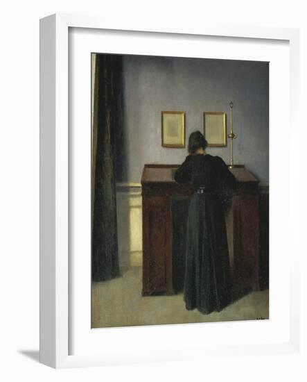 A Lady Writing at Her Desk-Vilhelm Hammershoi-Framed Giclee Print