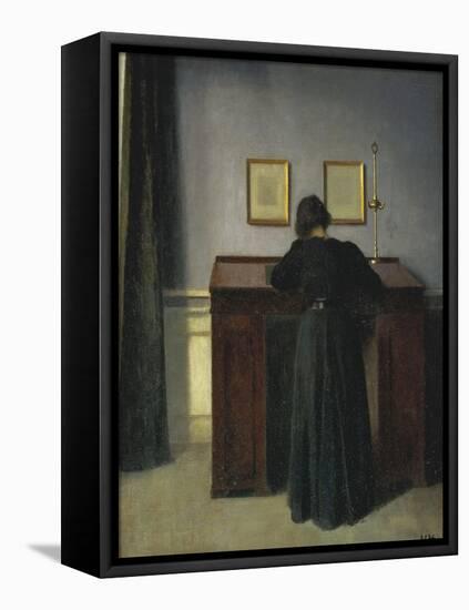 A Lady Writing at Her Desk-Vilhelm Hammershoi-Framed Stretched Canvas