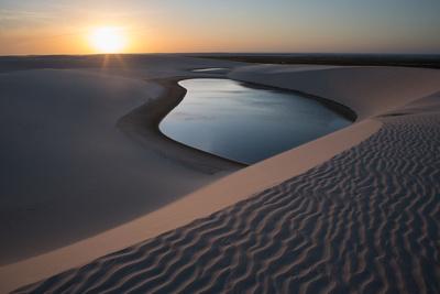 https://imgc.allpostersimages.com/img/posters/a-lagoon-at-sunset-in-the-sand-dunes-in-brazil-s-lencois-maranhenses-national-park_u-L-PSWB040.jpg?artPerspective=n