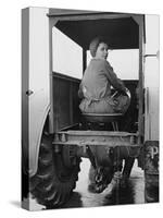 A Land Girl Driving a Tractor on a Farm During World War Ii-Robert Hunt-Stretched Canvas
