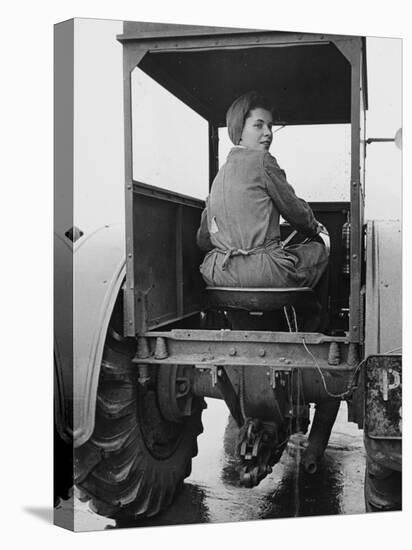 A Land Girl Driving a Tractor on a Farm During World War Ii-Robert Hunt-Stretched Canvas