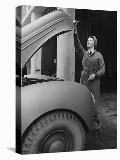 A Land Girl Mechanic Working on a Car During World War Ii-Robert Hunt-Stretched Canvas