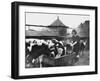 A Land Girl Working Feeding Cattle on a Farm During World War Ii-Robert Hunt-Framed Photographic Print