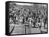 A Large Crowd of People Running Through the Streets During the Dodge City Parade-Peter Stackpole-Framed Stretched Canvas